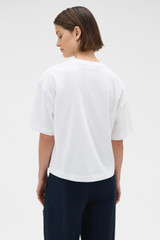 Profile view of model wearing the Oroton Relaxed Sleeve Tee in Antique White and 100% cotton fabric for Women . IP:6