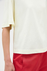 Profile view of model wearing the Oroton Relaxed Sleeve Tee in Lemon and 100% cotton fabric for Women . IP:4