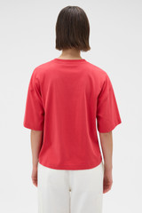 Profile view of model wearing the Oroton Relaxed Sleeve Tee in Market Red and 100% cotton fabric for Women . IP:6