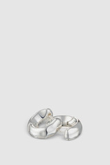 Detail product shot of the Oroton Aurie Huggie in Bright Silver and Brass with sterling silver earring post for Women . IP:21