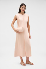 Profile view of model wearing the Oroton Double Satin Sheath Dress in Peach and 100% viscose fabric for Women . IP:6