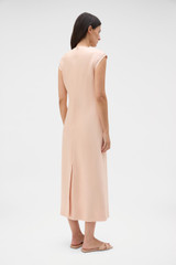 Profile view of model wearing the Oroton Double Satin Sheath Dress in Peach and 100% viscose fabric for Women . IP:5