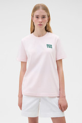 Profile view of model wearing the Oroton Maggie Graphic Tee in Perfect Pink and 100% cotton single jersey fabric for Women . IP:2