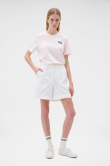 Profile view of model wearing the Oroton Maggie Graphic Tee in Perfect Pink and 100% cotton single jersey fabric for Women . IP:6