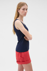 Profile view of model wearing the Oroton Scoop Neck Tank in North Sea and 92% cotton and 8% spandex blend fabric for Women . IP:3