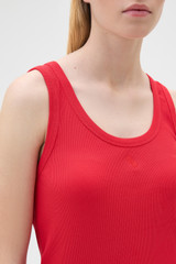 Profile view of model wearing the Oroton Scoop Neck Tank in Robbin Red and 92% cotton and 8% spandex blend fabric for Women . IP:4