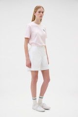 Profile view of model wearing the Oroton Flat Front Carpenter Short in Antique White and 100% cotton fabric for Women . IP:3