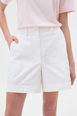 Profile view of model wearing the Oroton Flat Front Carpenter Short in Antique White and 100% cotton fabric for Women . IP:4