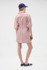 Profile view of model wearing the Oroton Railroad Drill Dress in Robbin Red and 100% cotton fabric for Women . IP:5
