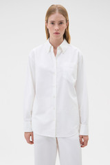 Profile view of model wearing the Oroton Oxford Shirt in Antique White and 100% cotton fabric for Women . IP:2