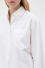 Profile view of model wearing the Oroton Oxford Shirt in Antique White and 100% cotton fabric for Women . IP:4