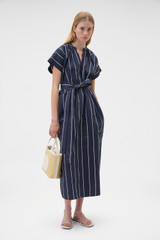 Profile view of model wearing the Oroton Stripe Detail Dress in Denim Blue and 100% cotton fabric for Women . IP:6