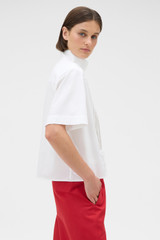 Profile view of model wearing the Oroton Pleat Detail Shirt in White and 100% cotton fabric for Women . IP:3