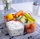 Compostable 2-compartment PLA to-go box with snacks Compostable 2-compartment PLA to-go box with snacks