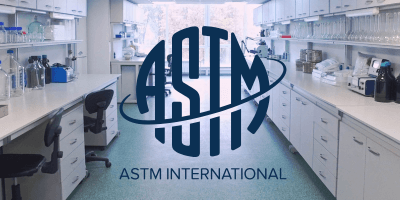 ASTM compostable logo on photo of lab tables