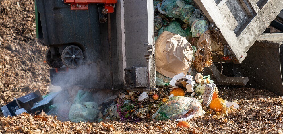 Commercial composting site dumping load to be composted