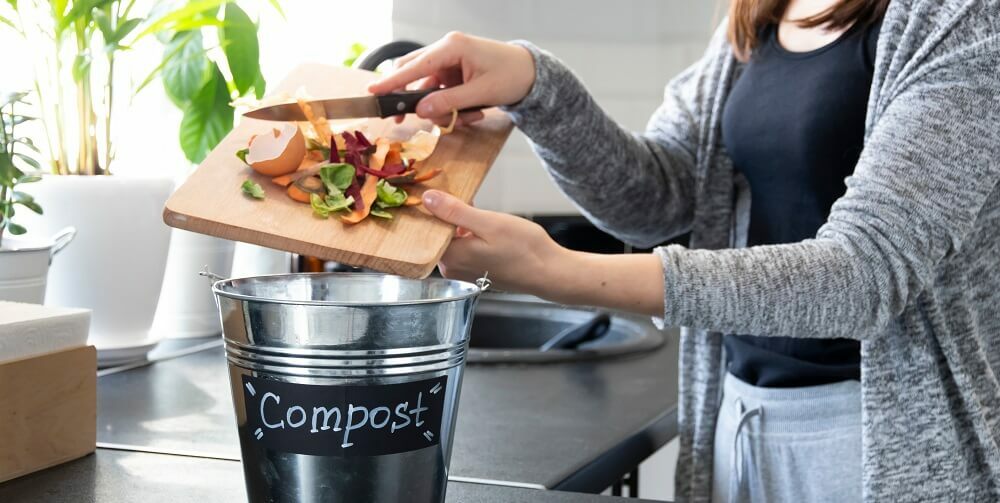 Person composting at home