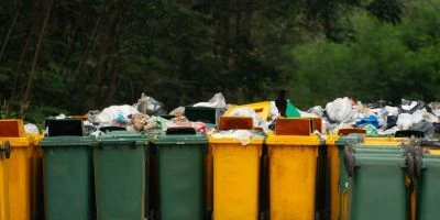 various overflowing trash cans