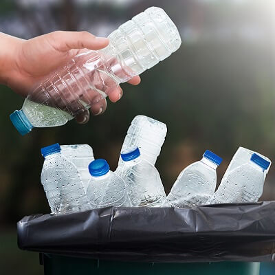 person holding plastic bottle