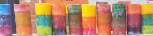 grouping of 3"x7.25" round pillar candles with three colors each. Bright colors