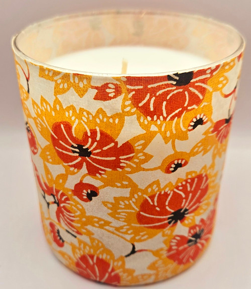 This is a cream background with yellow and orange funky blossoms stenciled on the paper