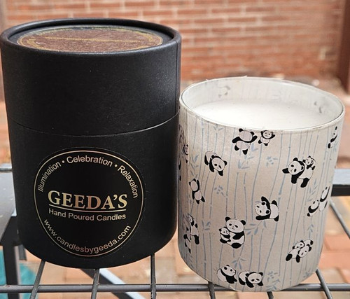 This candle has pandas frolicking on a silver and blue background.  The round box these candles are packaged in is also shown