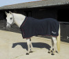 Best quality suede fleece rug (anti-pill), suitable for stable wear, travelling and at shows. Features single chest strap, with a touch tape closing chest skirt and an elastic surcingle.
A super snug padded neck line for comfort and to reduce rubbing.
'Hidden' elastic surcingle fasten under belly.