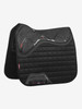 The Twin Sided X-Grip Dressage square combines the stylish, iconic LeMieux cut with the new X-Grip silicone & bespoke Acavallo Gel mould to provide the maximum saddle stability, shock absorbency and grip of any saddle pad! The unique 3 layer design combines the X-Grip silicone top side, Blast foam core & Acavallo gel underside to create one low profile highly effective pad. The lower density memory foam under the X-Grip silicone aids saddles to bed down and stabilise whist the bespoke X-Grip Acavallo gel underside has the same low profile, non-slip credentials as all Acavallo products. This twin sided technology makes this the most elite product in the LeMieux stable.
 

Designed to fit a wide range of dressage saddles with its cut back high wither & signature girth protection area, with multiple girthing options. The luxurious suede top side is complimented by a new super soft Bamboo lining to absorb & control sweat under the saddle and are beautifully comfortable and secure - minimising friction.