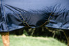 In smart Navy with gold piping and reflective detail, a super looking 50g turnout providing vital protection for your horse.

Keeping them warm & dry on those unexpected, squally days, the rug is crafted in a tough, durable 1680D ballistic, basket weave fabric, which is highly abrasive resistant and performs extremely well in a downpour.

Tailored with generous shoulder gussets allowing greater freedom of movement, it also features a removable, Velcro neck piece including ruched binding at the top for an ultimate fit.

Finished with detachable leg straps and adjustable double clip chest closures, a versatile choice for colder weather, clipped horses as well as your finer breeds.