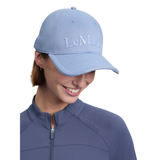 Banish the sun's harmful rays the old-school way with LeMieux's update to the classic baseball cap, complete with a metal slide adjuster.

Colourful cotton twill, a structured shape, air vents and a button-top are brought bang up to date with tonal, matte-printed centralised LeMieux branding.