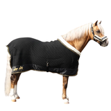 This stunning rug with luxurious faux sheepskin collar provides ultimate comfort and style for your horse or pony. Made from premium quality, high performing fabric that benefits from excellent moisture wicking and insulating properties, it will keep you horse cool and comfortable. The diamond quilted panels contour their shape for a snug fit, while the wipe clean filet string and a detachable under belly strap enhance practicality. This rug is perfect for using in the cooler months to maintain your horse’s clipped coat, after bathing, as a travel rug and is also ideal for wearing at competitions while waiting in the collecting ring. Team with the rest of the Supreme Products Royal Occasion collection for a winning look. This stunning rug with luxurious faux sheepskin collar provides ultimate comfort and style for your horse or pony. • Made from high performing, moisture wicking, insulating fabric• Diamond quilted panels contour the horse’s shape for a snug fit• Featuring wipe clean filet string and a detachable under belly strap for enhance practicality• Perfect for using in the cooler months to maintain a clipped coat, after bathing, as a travel rug or while at competitions. Luxury faux sheepskin neck collar for added comfort