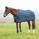 An essential rug for your horse’s wardrobe. This liner rug is made from a 300 denier soft touch fabric, it almost feels like a duvet! With touch tape front fastening and fillet string, this simple rug ensures there are not too many straps to fasten or get in your horse’s way. The snug 200g fill will keep your horse or pony cosy when it is needed most.