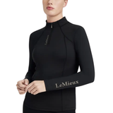 Do it all in this UPF50+ quarter zip base layer. Its technical fabric regulates your body temperature, with vented underarms to keep you cool and dry. Contrast matte logo print is a subtle sign of the quality you expect from LeMieux.

With stretch for unrestricted comfort, there's nothing this base layer can't do. The silky-smooth fabric, ultra-soft seams and flat lock stitches reduce chafing and keep bulk to a minimum when worn under a fleece, jacket or gilet.