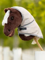 This Hobby Horse Fly Rug is a realistic accessory to add to your LeMieux Hobby Horse collection.

It's made from gladiator mesh – just like the regular-sized version – with beautiful navy and mist binding. The full neck and T-bar front closure make this fly rug a real must-have for the smartest ponies around.

It even comes in a mini rug bag! Super cute.

Suitable for ages 3+