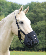 Shires grazing muzzles are proven to help with controlled or restricted feeding regimes and special diets. The Comfort Grazing Muzzles are cut back under the chin to avoid unnecessary pressure and improve the fit. The muzzle features a rubber base with a hole in the bottom through which grass can enter, reinforced nylon web bars which allow free air exchange and the anti-chafe padding around inside of the muzzle protects the delicate nose and chin. The head and throat straps benefit from anti-chafe padding and the fully adjustable harness is fitted with a field safe fastening . The D-ring allows a lead rope to be attached.