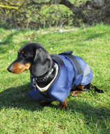 A 600denier waterproof ripstop outer, fully fleece lined. Adjustable touch tape belly strap and thin elastic little leg straps . The Highland coat also features a zip to allow for a harness to be attached.