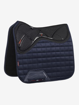 The X-Grip Dressage square combines the stylish, iconic LeMieux cut with the new X-Grip silicone design to ensure saddle stability and grip. The Memory Foam under the saddle area aids with comfort and shock absorbency. The unique blast foam core has been through a process where hot air is forced through the memory foam under pressure to create the extremely breathable yet supportive and lightweight perforated material.


Designed to fit a wide range of dressage saddles with its cut back high wither & signature girth protection area, with multiple girthing options. The luxurious suede top side is complimented by a new super soft Bamboo lining to absorb & control sweat under the saddle and are beautifully comfortable and secure - minimising friction.