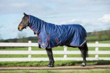 The Mackey Keadeen Plus Full Neck Heavy Turnout Rug is an all-weather rug designed for maximum comfort and protection. It is made of 600 denier ripstop with a 210d polyester lining, fleece wither protection, and a 250g filling. The waterproof and breathable fabric, detachable leg straps, leg gussets, tail flap, and cross surcingles with rubber rings ensure a secure fit. Reflective strips enhance visibility at night.