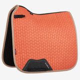 Now with our Super Soft Suede Binding & New PU Leather girth protection area, this beautiful suede Dressage square sets new standards in style & comfort. Now established as the iconic LeMieux look when combined with matching polo bandages and fly hoods there are colours to suit most horses and tastes. Designed to fit a wide range of dressage saddles with its high wither and elasticated D-Ring tabs .
 

The luxurious suede top side with soft suede binding is complimented by a new super soft Bamboo lining to absorb & control sweat under the saddle and are beautifully comfortable and secure - minimising friction