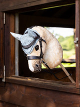 Our Hobby Horse Fly Hood is an identical miniature version of the Classic Fly Hood.Crafted from intricate handmade crochet in sweet and smart colours, it looks just like the real thing. We've even added soft suede ears and a braided trim, giving your Hobby Horse a sophisticated mixy matchy look!Suitable for ages 3+