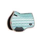 Described as the most stylish saddle pad LeMieux has ever produced, the Loire Collection exudes sophistication and style, while delivering technical advancement.
Woven Loire satin upper benefits from a wonderfully soft and breathable natural bamboo blend lining. The bamboo material controls heat and wicks efficiently to keep your horse cool under the saddle.
The high wither shape reduces pressure and enhances the fit of your saddle. Elasticated saddle straps are slimmer at the point of connecting to the D-ring, leaving room for extra accessories.
The whole pad benefits from an extensively-researched, soft, friction-free binding which is specially fabricated to smoothly contour the edges. This new technique helps retain the perfect saddle pad shape and binding profile.
The textured faux leather girth protection area is complemented by an embossed logo and carries the usual signature LeMieux lower girth strap with its inner girth loops.
A unique LeMieux logo metal badge on a leather mount in the lower back corner provides a luxurious finishing touch. Described as the most stylish saddle pad LeMieux has ever produced, the Loire Collection exudes sophistication and style, while delivering technical advancement.
Woven Loire satin upper benefits from a wonderfully soft and breathable natural bamboo blend lining. The bamboo material controls heat and wicks efficiently to keep your horse cool under the saddle.
The high wither shape reduces pressure and enhances the fit of your saddle. Elasticated saddle straps are slimmer at the point of connecting to the D-ring, leaving room for extra accessories.
The whole pad benefits from an extensively-researched, soft, friction-free binding which is specially fabricated to smoothly contour the edges. This new technique helps retain the perfect saddle pad shape and binding profile.
The textured faux leather girth protection area is complemented by an embossed logo and carries the usual signature LeMieux lower girth strap with its inner girth loops.
A unique LeMieux logo metal badge on a leather mount in the lower back corner provides a luxurious finishing touch.