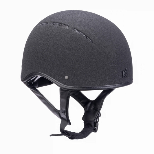 Elevated comfort and style meets excellent safety reassurance in the Karben Icon ALX Jockey Skull. The Karben bespoke-fit dial allows fine size adjustment to ensure a secure and comfortable fit. The matte black Karben insignia and premium trims look smart. ront and rear air grills work with the 3D mesh liner for maximum temperature regulation. Wrapped in microfibre leather, the adjustable 4-point harness offers secure comfort and fastens with a quick release buckle. FINER DETAIL: Durable sand-sprayed outer helmet finish. Scratch resistant carbon wrapped rim. BESPOKE FIT Micro Adjustable Dial System. FRESH FEEL front and rear air grills. SHOCK ABSORBING expanded polystyrene inner shell with targeted PASSIVE VENTILATION SYSTEM. Deeply padded COMFORT LUXE LINER with CoolDryTM headband and THERMOREGULATING 3D mesh crown. Fully adjustable 4-point harness with soft faux leather wrapped sides. Quick release buckle. Removable anti-rub chin guard. Machine washable linings. Reusable drawstring storage bag. Thoroughly tested and certified to PAS 015:2011 and EN 1384:2023. CE & BSI Kitemark.