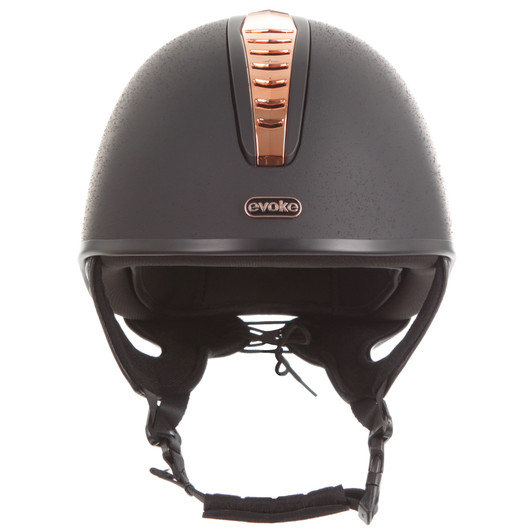 Introducing the stellar Orion Jockey Skull. Boasting a an elegant rose gold & black vent and sanded black finish. A rose gold ‘evoke’ branded logo at the forehead completes the look.
  
Conforms to PAS 015: 2011 Standard; EN 1384 2023; ASTM F1163-23
Kitemarked to PAS 015: 2011
CE & UKCA marked
Lightweight ABS jockey Skull
Fully ventilated with stylised contrast panels and reinforcement mesh
Soft touch four-point adjustable leatherette harness with rear lacing