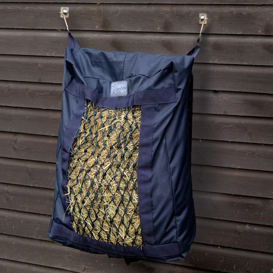 The Slow Flow Pillow Haynet is perfect for greedy feeders, those on a diet or horses that need their ad lib forage controlled - convenient and easy to use, ideal for travelling, in the stable or in the field. Easy to fill, this hay bag will reduce mess and waste while keeping your horse occupied. Featuring an adjustable strap and clip fastening for quick and easy hanging. Made from a waterproof, 1680 denier fabric with rectangular hay hole covered with individually crafted 4cm small holes to slow hay consumption and trickle feed your horse or pony, ensuring better digestion and less waste on the floor.