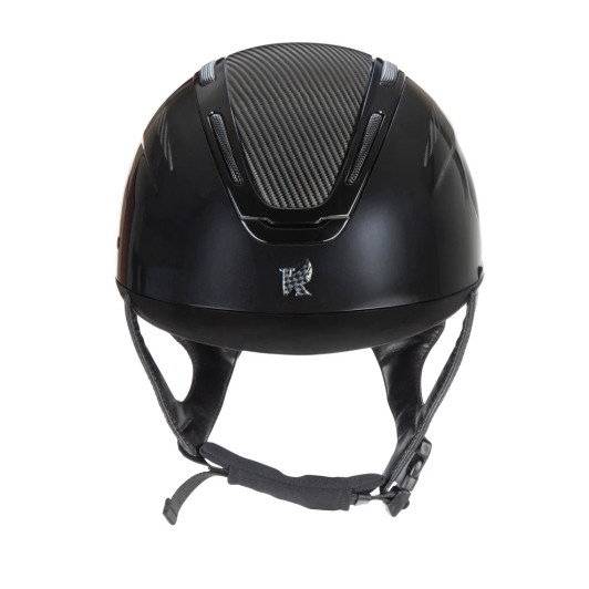 Karben Amity blends top-tier performance and safety with striking personality and style, giving every rider the perfect balance of confidence and comfort. A high gloss frame and peak meet a gloss sculpted shell, accented by the centred Karben insignia – the hallmark of modern safety. ELMT features a graphic print to the centre panel and insignia, finished in high gloss for a unified aesthetic. The AIR-XC System of six outer and ten inner vents work, promote air exchange, removing warm moist air and drawing in fresh air to keep the head comfortable through any ride. Karben hats are thoroughly tested to the latest certifications for horse riding and feature carefully thought through safety and comfort measures to benefit the rider. Finer detail: BESPOKE FIT Micro Adjustable Dial System. PASSIVE AIR-XC SYSTEM channels heat release and ventilation. SHOCK ABSORBING expanded polystyrene inner shell engineered with 10 targeted ventilation shafts. Flexible fixed peak for impact energy absorption. Deeply padded COMFORT LUXE LINER with CoolDryTM headband and THERMOREGULATING 3D mesh crown. Fully adjustable 4-point harness in stretch resistant web with embossed soft faux leather wrapped sides. Quick release buckle. Removable anti-rub chin guard. Machine washable linings. Reusable drawstring storage bag. Amity hats meet the safety requirements of PAS015:2011 and BS EN 1384:2023 with the CE mark and BSI Kitemark.