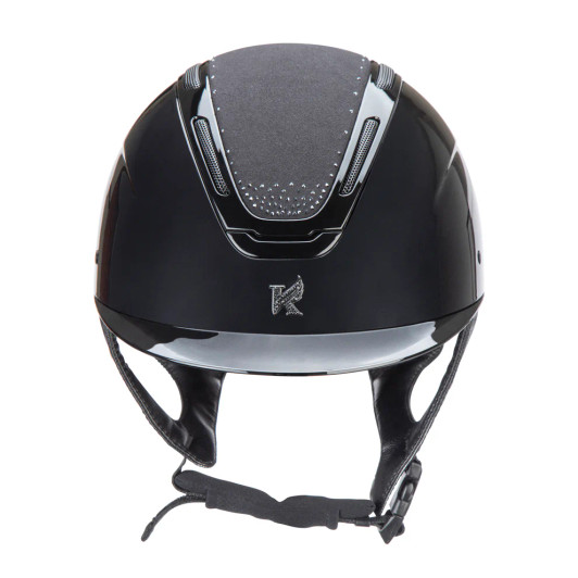 Karben Amity blends top-tier performance and safety with striking personality and style, giving every rider the perfect balance of confidence and comfort. A high gloss frame and peak meet a gloss sculpted shell, accented by the centred Karben insignia – the hallmark of modern safety. SPKL features tonal diamante detail at the crown, perfectly set off by the matt microfibre crown and followed through in the insignia for extra glitz. The AIR-XC System of six outer and ten inner vents work, promote air exchange, removing warm moist air and drawing in fresh air to keep the head comfortable through any ride. Karben hats are thoroughly tested to the latest certifications for horse riding and feature carefully thought through safety and comfort measures to benefit the rider. Finer detail: BESPOKE FIT Micro Adjustable Dial System. PASSIVE AIR-XC SYSTEM channels heat release and ventilation. SHOCK ABSORBING expanded polystyrene inner shell engineered with 10 targeted ventilation shafts. Flexible fixed peak for impact energy absorption. Deeply padded COMFORT LUXE LINER with CoolDryTM headband and THERMOREGULATING 3D mesh crown. Fully adjustable 4-point harness in stretch resistant web with embossed soft faux leather wrapped sides. Quick release buckle. Removable anti-rub chin guard. Machine washable linings. Reusable drawstring storage bag. Amity hats meet the safety requirements of PAS015:2011 and BS EN 1384:2023 with the CE mark and BSI Kitemark.