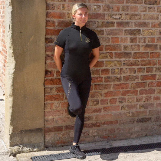 Perfectly produced from quick-dry, sport-tech fabric with excellent four-way stretch and advanced breathability properties, this buttery soft short sleeved base layer offers a sculpted fit and flattering silhouette. Providing UV block protection (50+) and increased ventilation from a strategically placed airflow system under the arms, across the shoulders, and down the back, it aids body temperature regulation, making it the perfect top for the active equestrian.