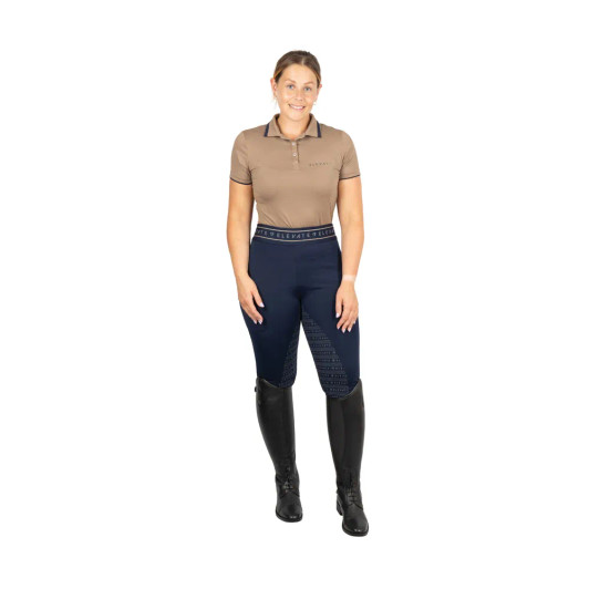 Create a classic look this season with the Elevate Style Polo Top. Designed using a highly moisture wicking and easy care fossil fabric for optimal breathability, flexibility and airflow, meaning this essential piece will keep you cool and comfortable. With a traditional polo collar detailed with navy edging and fastened with tonal buttons, this can be worn in the traditional style or stood up for extra protection. Finished with discrete navy edging to the hems of the short sleeves and gunmetal Elevate logo to the chest, allowing this to match perfectly with the rest of the range, or can be worn alone for a casual style.