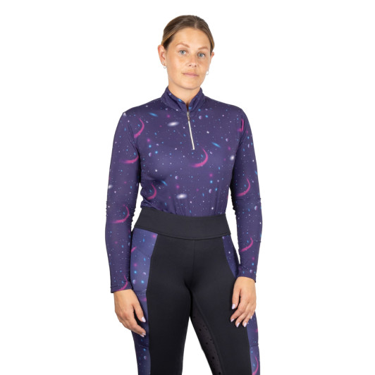 Stand out from the crowd and ride among the stars with the Elevate Out of this World Base Layer. Designed for performance, comfort, and serious style, this striking base layer features a vibrant galaxy print that’s sure to turn heads in and out of the saddle. Crafted from soft, breathable, and moisture-wicking fabric, it keeps you cool and comfortable whether you're training, hacking, or working on the yard. The close-fit design and four-way stretch ensure full freedom of movement, while the lightweight material makes it perfect for layering under jackets or wearing on its own in warmer weather. Finished with a half zip for adjustable ventilation and a sleek, athletic silhouette, this base layer is as practical as it is eye-catching. Pair it with matching pieces from the Out of this World collection for a truly stellar look.