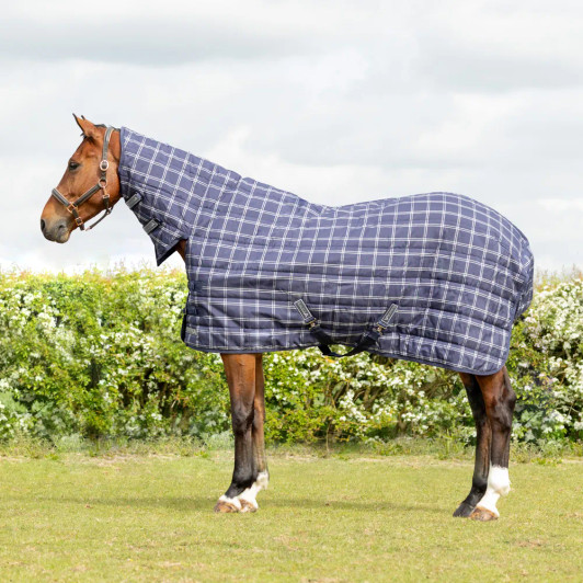 The StormX Empra Extra 250 Combi Stable Rug is designed to provide your horse with warmth, comfort, and full-coverage protection while stabled. Designed using a durable 1200 denier material with a 250g insulated fill, this medium to heavyweight rug offers just the right amount of warmth for cooler conditions without causing overheating. The full-neck combo design ensures your horse stays shielded from drafts, while the soft, breathable lining promotes comfort and helps maintain a healthy coat. Crafted for a secure and adjustable fit, the rug features double clip and buckle chest fastenings, cross surcingles, and a generous tail flap for added stability and coverage. Whether you're preparing for a chilly night or simply want consistent indoor protection, the StormX Empra Extra 250 Combi Stable Rug delivers reliable performance and lasting comfort your horse will appreciate.